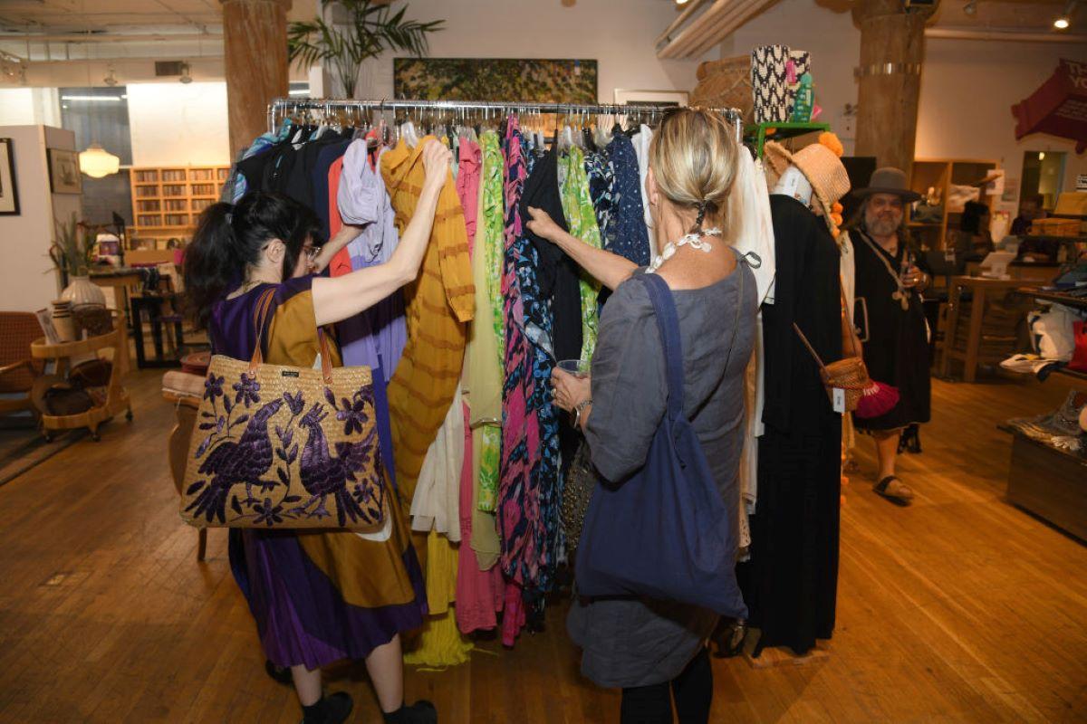 Exploring a clothing rack at a thrift shop in New York City