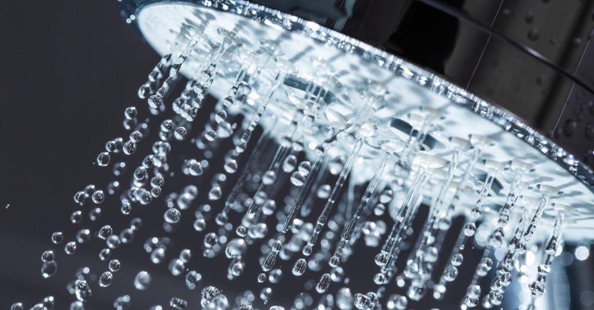 A shower head running water.