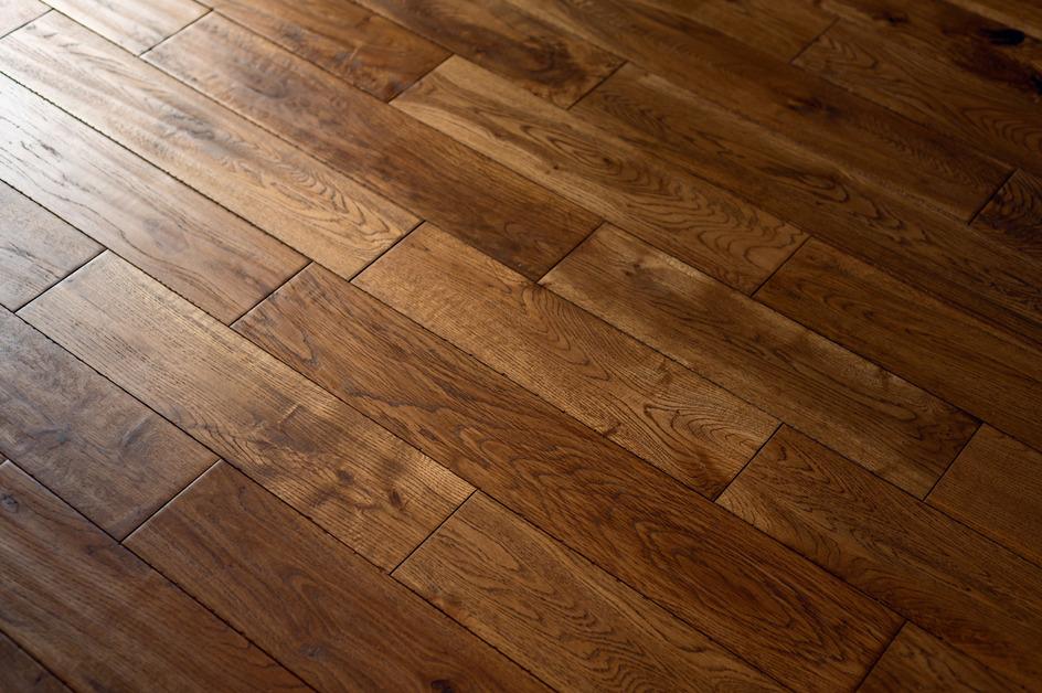 A photo of dark prefinished hardwood floors