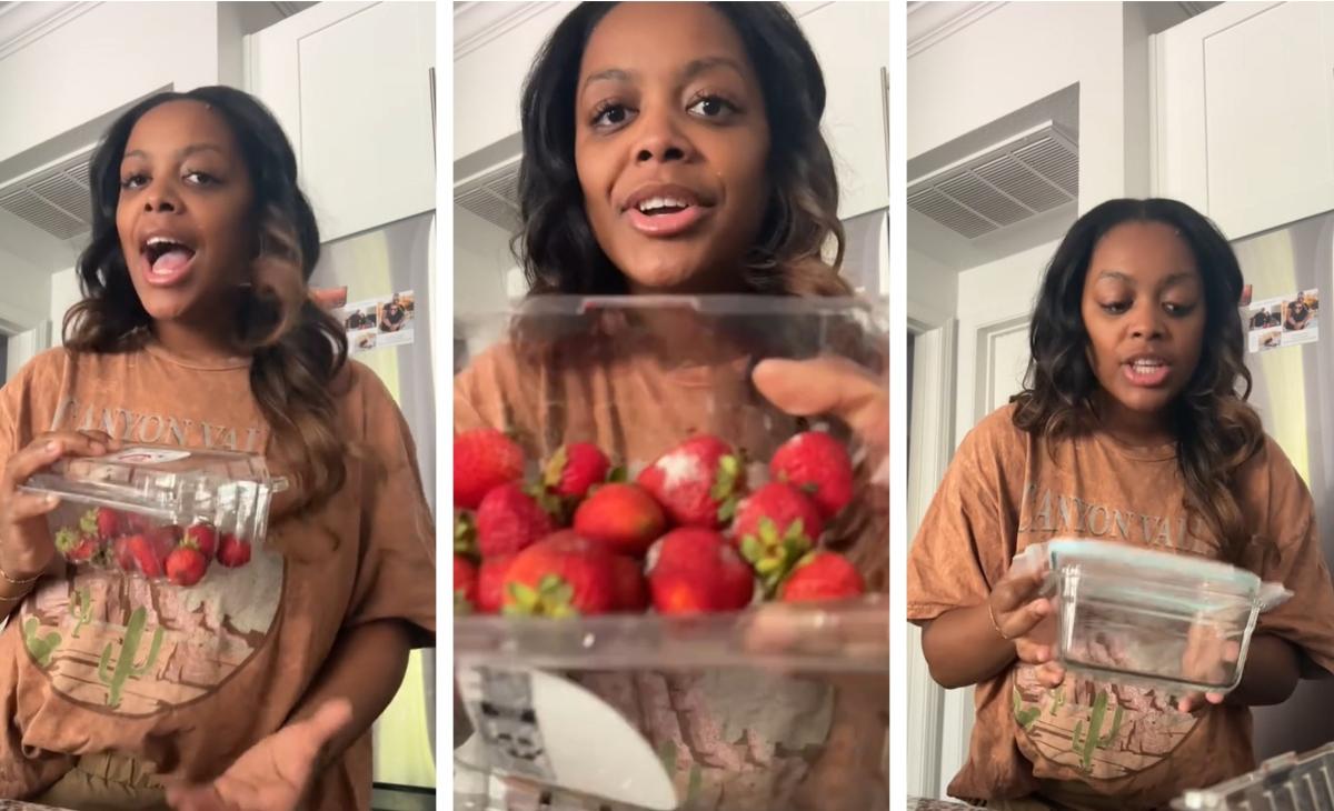 woman shows moldy strawberries and glass container