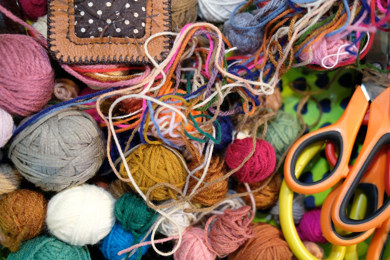 A close up of various yarn scraps of all colors and fibers.