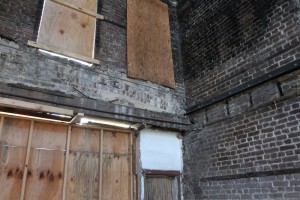 Original brick from the old building were saved and used for interior walls in the new building. 